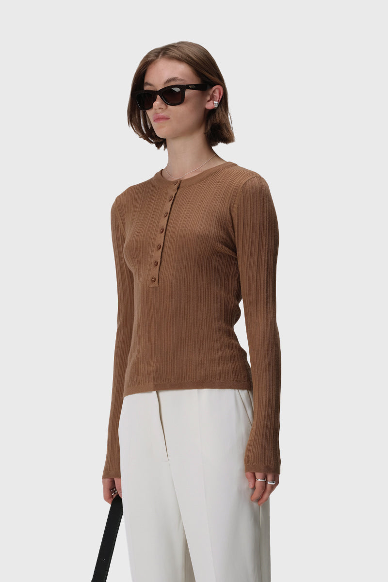 Long sleeve rib knit henley top with crew neckline, button front and slim fit