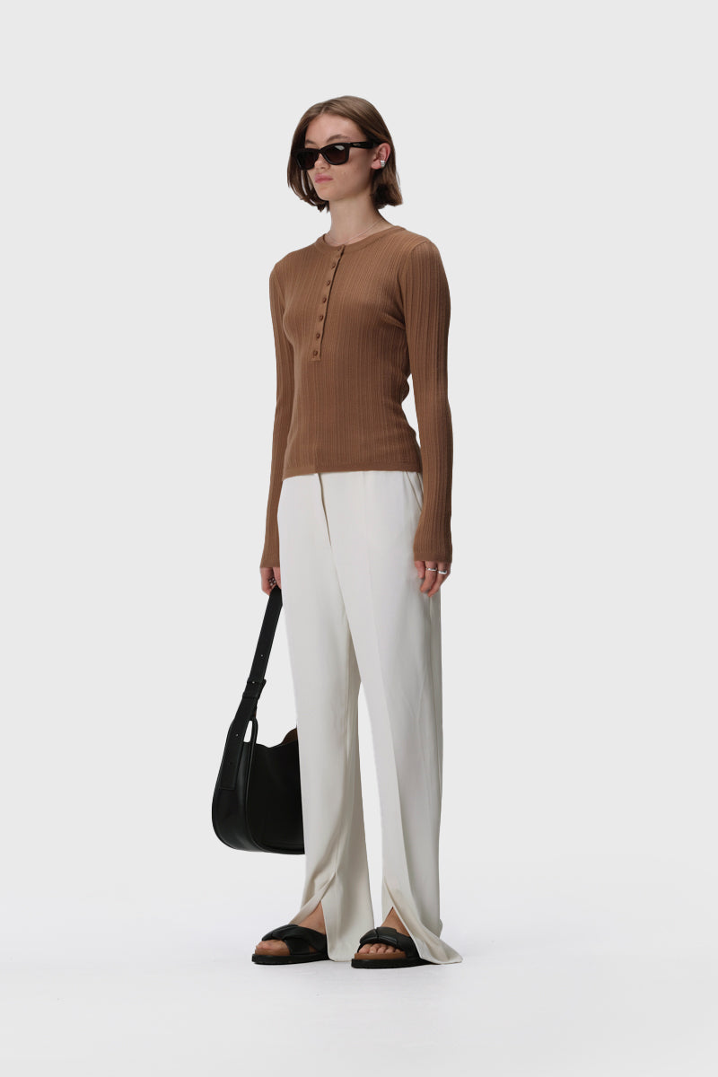 Long sleeve rib knit henley top with crew neckline, button front and slim fit
