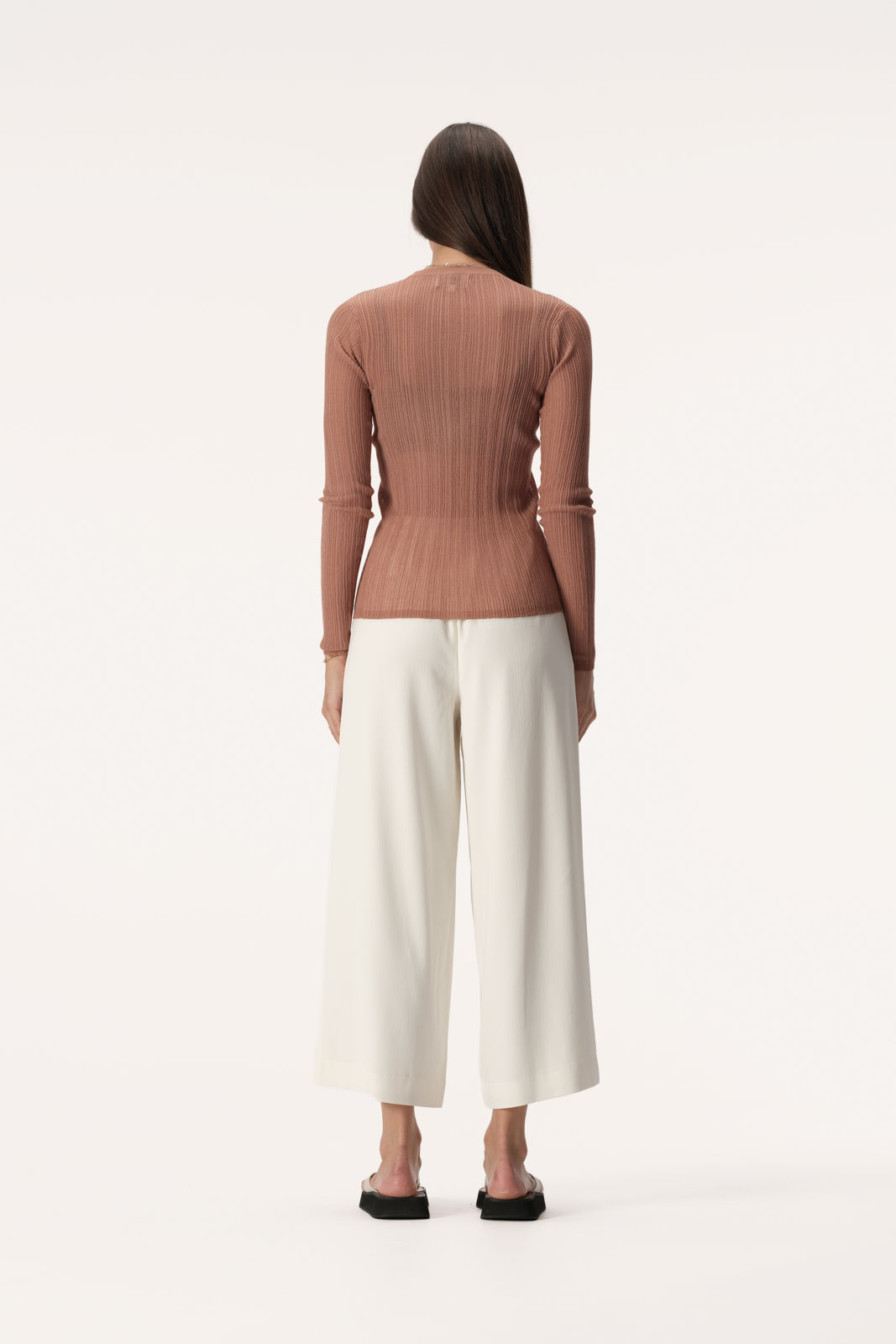 Semi sheer slim fit knit top with long sleeve, high neckline and crinkle texture