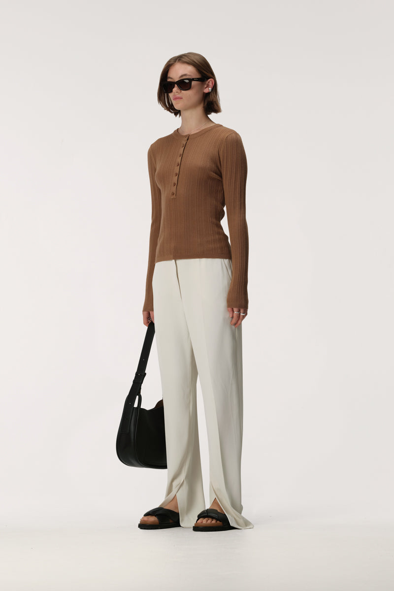 Long sleeve rib knit henley top with crew neckline, button front and slim fit