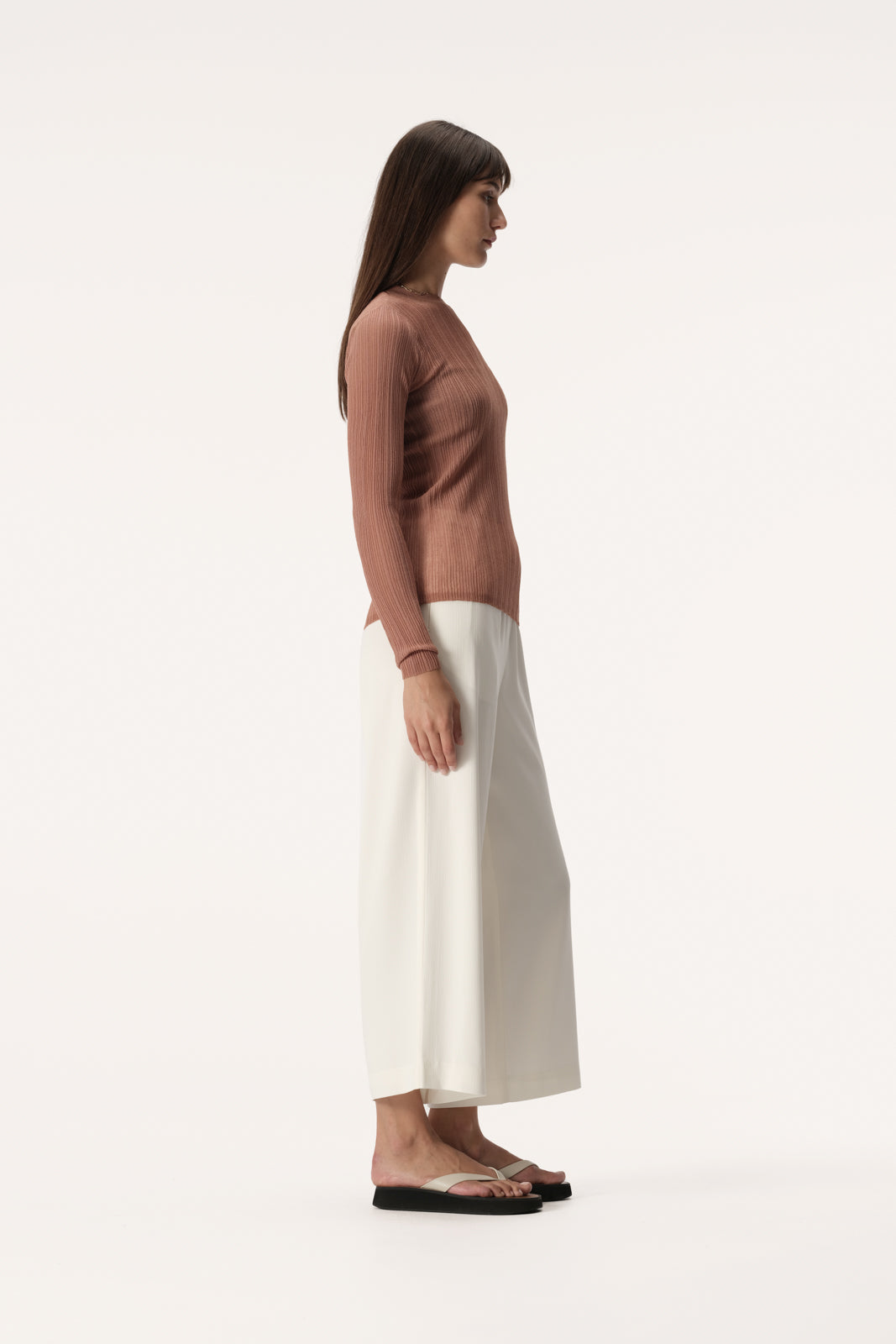 Semi sheer slim fit knit top with long sleeve, high neckline and crinkle texture