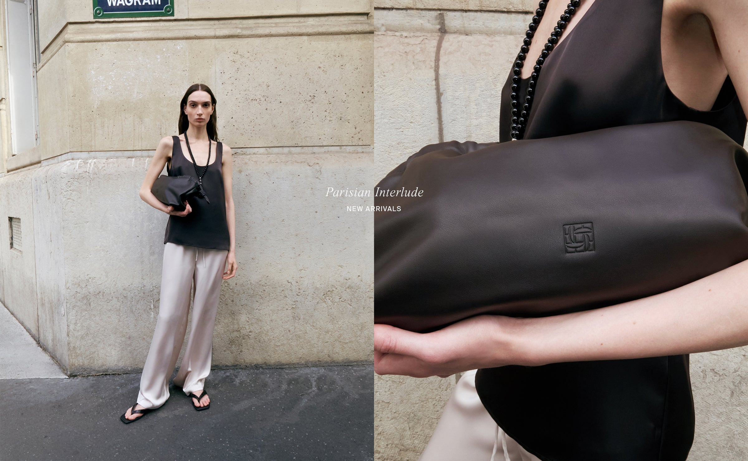 Woman holding a brown handbag with a brand logo against a stone wall.
