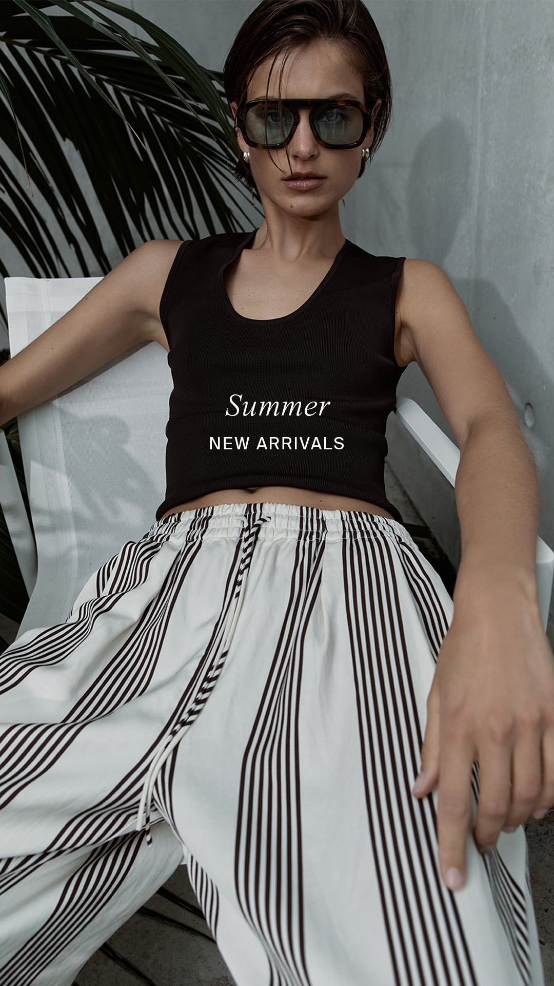 Person wearing a black tank top with 