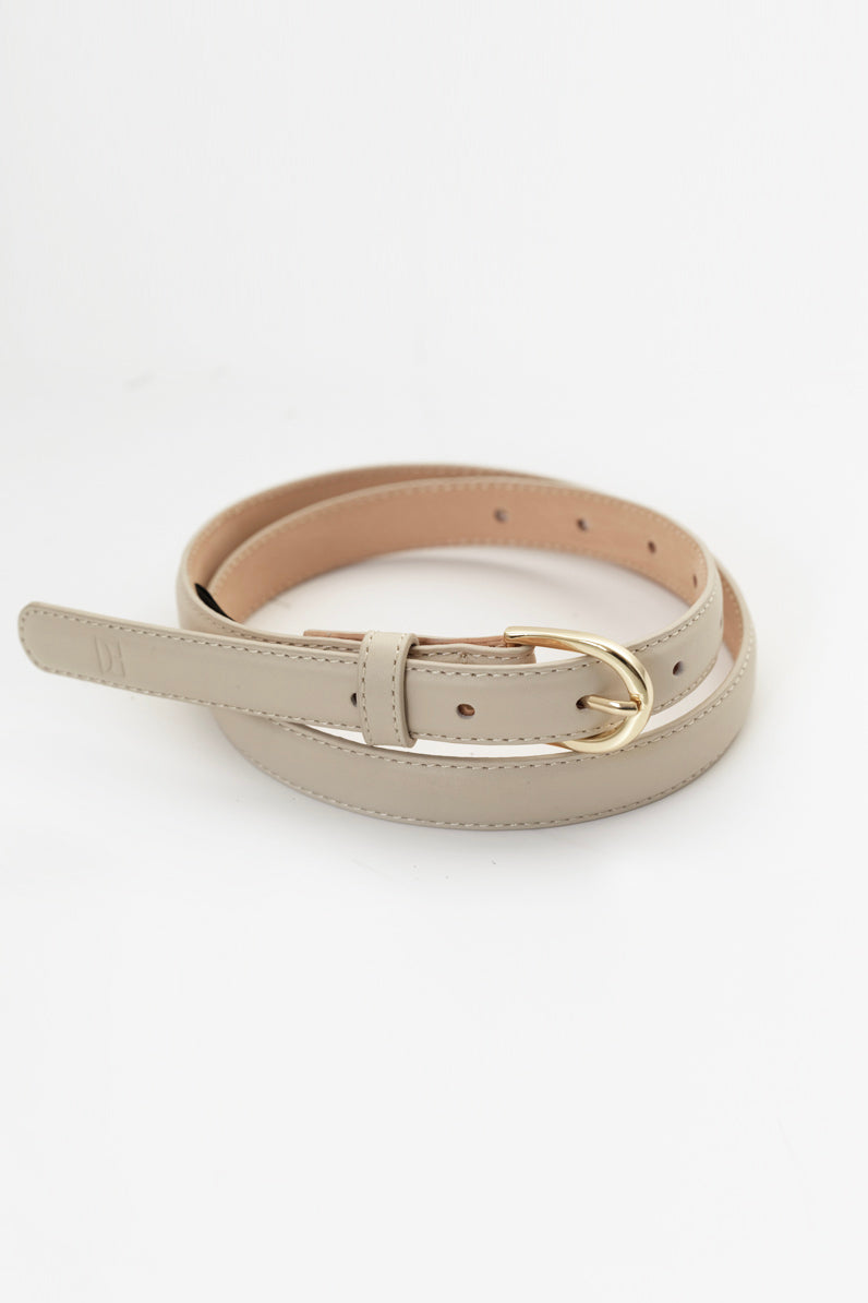 Thin leather belt with gold buckle and debossed Elka Collective monogram