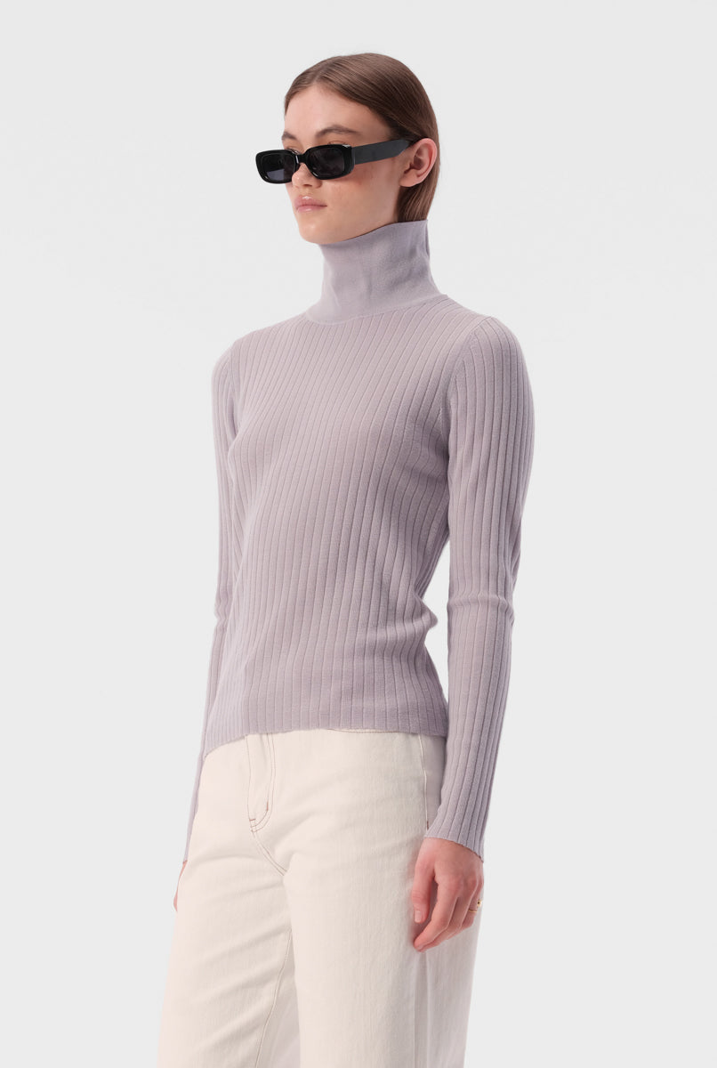 Slim fit turtleneck top with full length sleeves and ribbed texture fabric