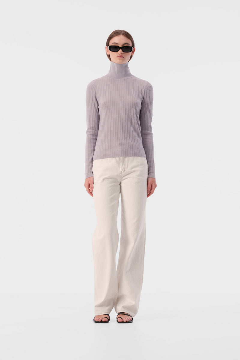 Slim fit turtleneck top with full length sleeves and ribbed texture fabric