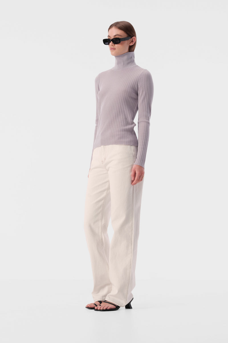 Slim fit turtleneck top with full length sleeves and ribbed texture fabric